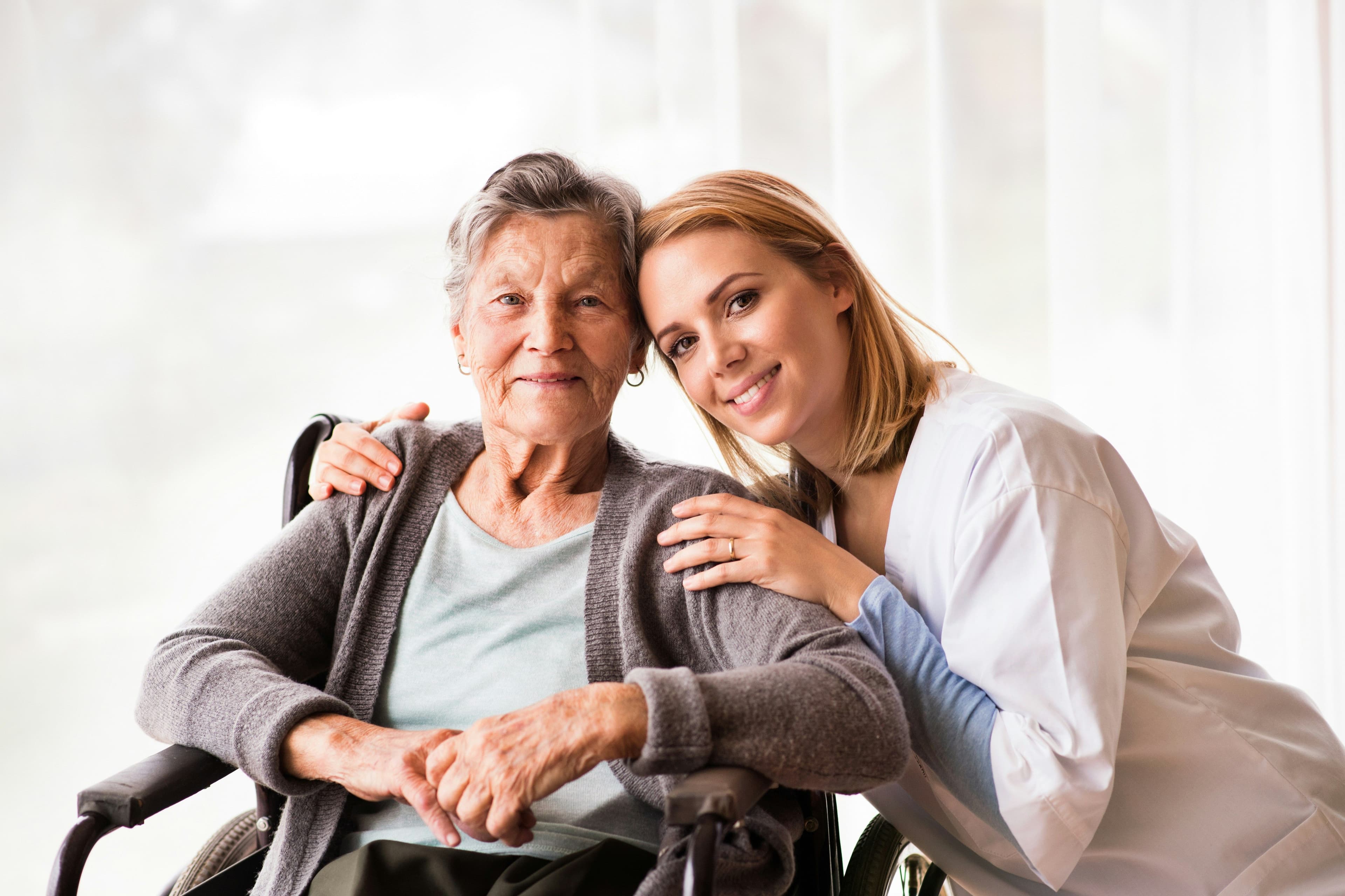 Senior and Homecare aide smiling in photo